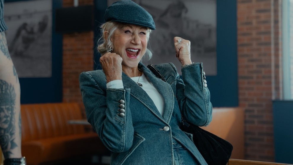 Helen Mirren smiles with and makes a triumphant gesture with her fists in the air in "MobLand" Season 2