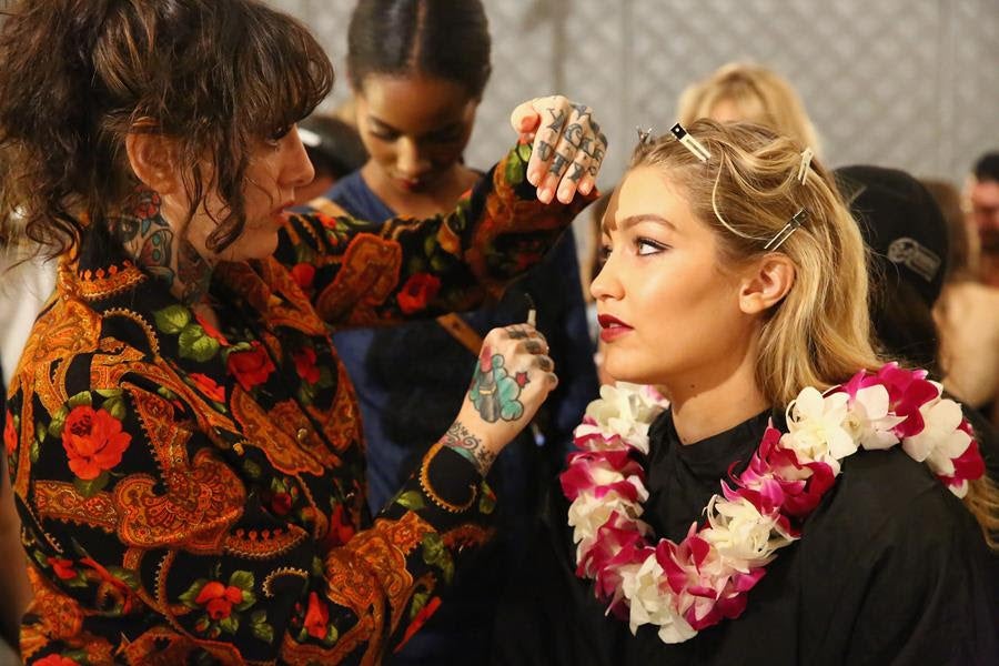 Makeup artist Erin Parsons (L) and model Gigi Hadid backstage at the Anna Sui Spring 2016 fashion show. Source: Getty