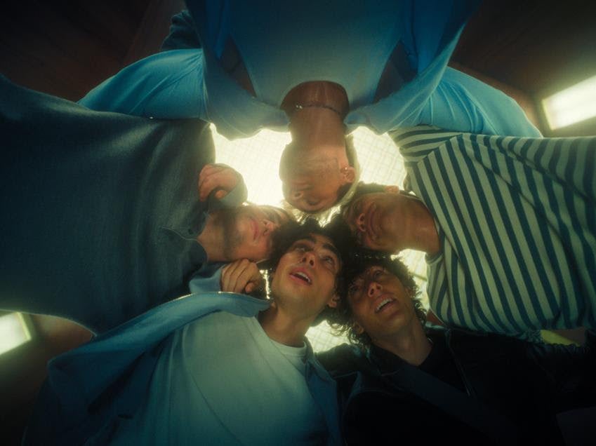 Film still of the Elevator Boys in Back to the '90s. Source: Amazon Prime