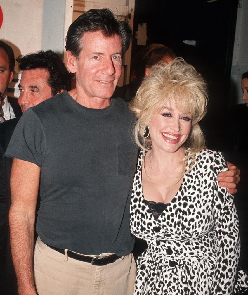 Calvin Klein and Dolly Parton during 1994 Fall Fashion Week at Bryant Park in New York City. Source: Getty