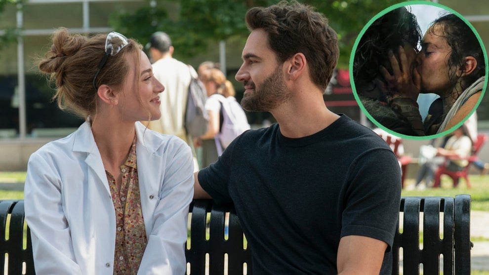 Woman in a lab coat and man in a black t-shirt smile at each other on a park bench, with an inset circular image of a couple kissing in a dramatic, disheveled scene.