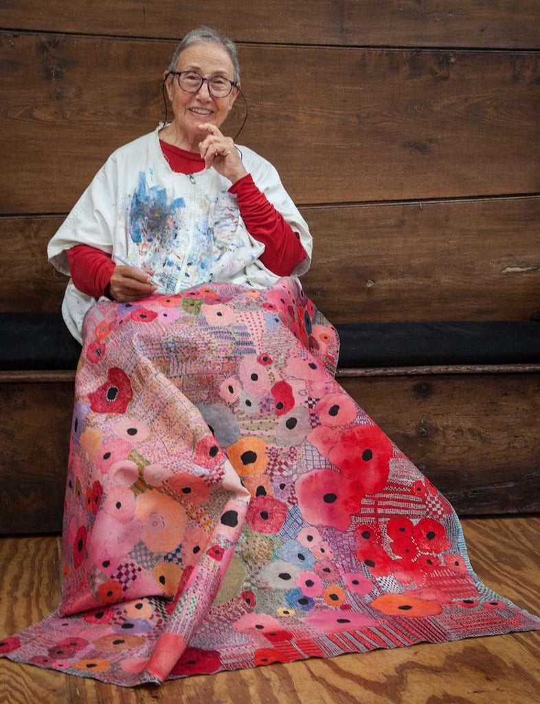 Huguette Caland with one of her tapestry-like works at her home and studio. Source: Huguette Caland Estate/Souheil Michael Khoury
